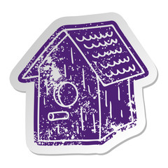 distressed old sticker of a wooden bird house