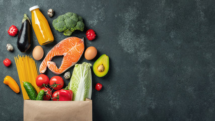 Supermarket. Paper bag full of healthy food.