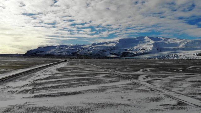 Icelandic ring road cover by fresh snow near the vatnajokull national park glacier video clip of passing cars