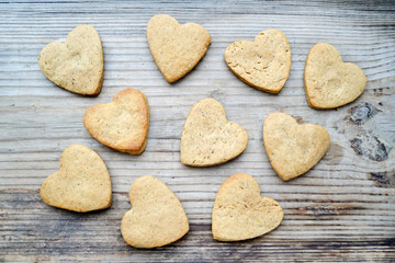 Gingerbread cookies in shape of heart on wooden table