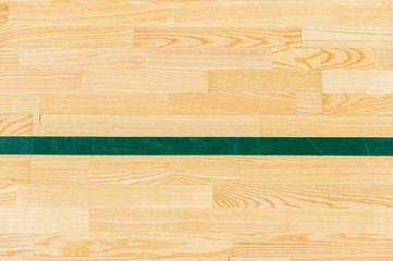 Green line on the gymnasium floor for assign sports court. Badminton, Futsal, Volleyball and Basketball court