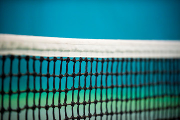 Net of tennis court on blue wall background
