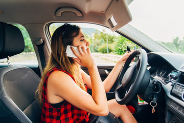 Girl having conversation on phone while driving, reckless driving