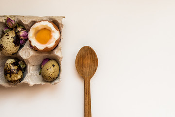 Egg boiled raw chicken egg quail egg tray wooden spoon breakfast white