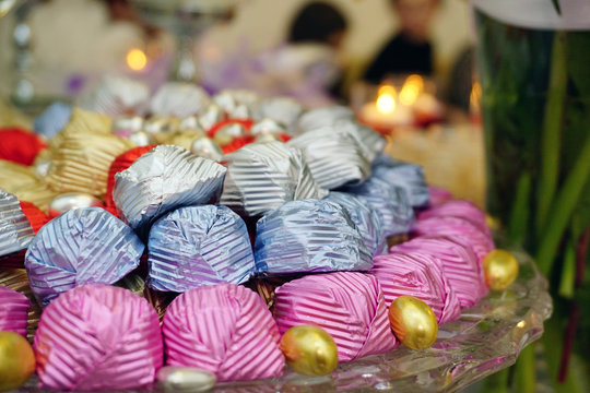 Engagement catering concept with ornaments candles cake and chocolate