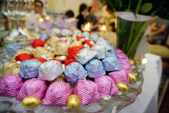 Engagement catering concept with ornaments candles cake and chocolate