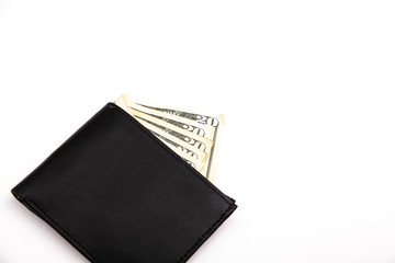 A black leather wallet on white showing five twenty dollar bills