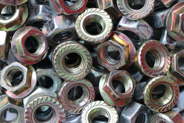 Background texture set of galvanized hex nuts of different types
