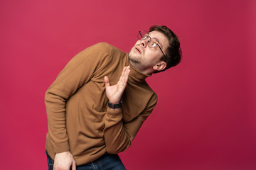 I'm afraid. Fright. Portrait of the scared man isolated on trendy pink studio background. Male half-length portrait. Human emotions, facial expression concept