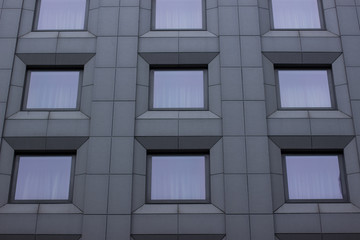 gray concrete windows symmetry frames building facade background material surface
