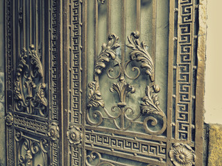 Ornament, detail of an iron gate. Iron-forged gates decor and ornament in the city streets. Old Tbilisi architecture 