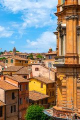 Perugia, Italy - Panoramic view of the Perugia historic quarter with medieval houses and ancient aqueduct valley through the Pallazzo Gallenga Stuart University building