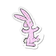 retro distressed sticker of a cartoon rabbit