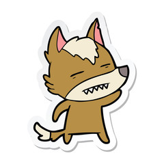 sticker of a cartoon wolf waving showing teeth