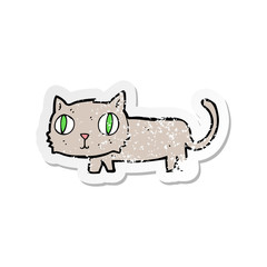 retro distressed sticker of a cartoon cat