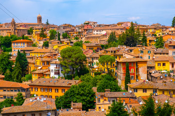 Obraz premium Perugia, Italy - Panoramic view of the Perugia historic quarter with medieval houses and academic quarter of University of Perugia and other academies