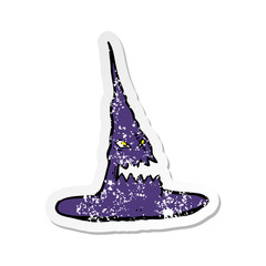 retro distressed sticker of a cartoon spooky witches hat