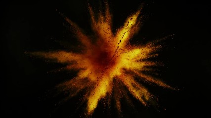 Super slowmotion shot of gold powder explosion isolated on black background.