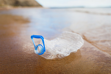 wasted plastic bottle on beach