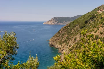 Fotobehang Italy, Cinque Terre, Corniglia, an island in the middle of a body of water © SkandaRamana