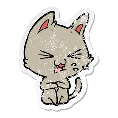 distressed sticker of a cartoon cat hissing