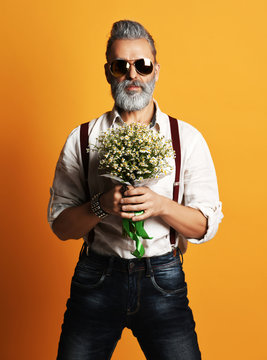 Brutal Senior Bearded Old Man In Aviator Sunglasses With A Bunch Of Flowers 