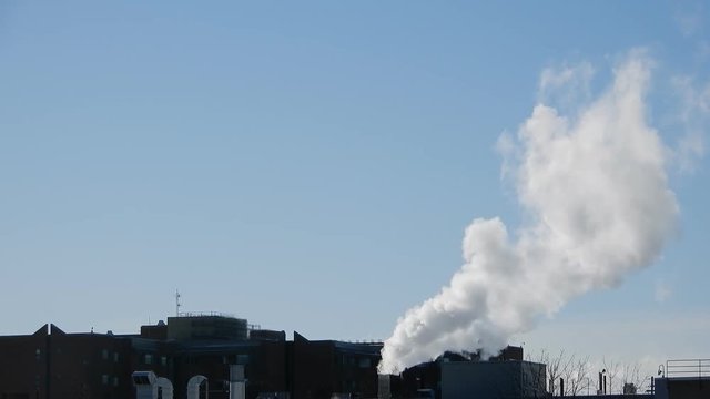 Smoke Polluting The Air Out Of Industrial Building Complex