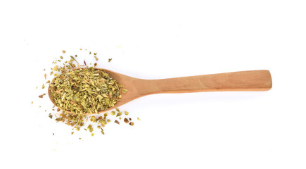 Top view of dried oregano leaves in wooden spoon isolated on white background