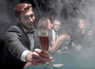 poker player with a glass of wine