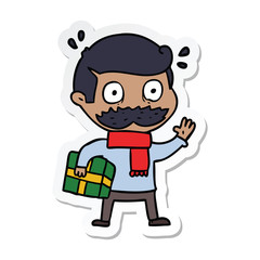 sticker of a cartoon man with mustache and christmas present