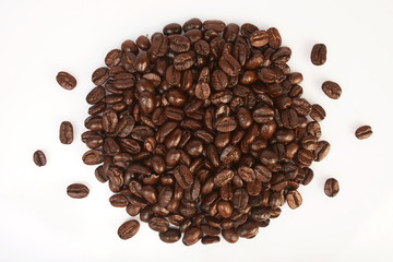 Several coffee beans on a white background