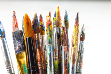 Paint brushes and paints for drawing.