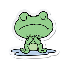 sticker of a cartoon frog in puddle