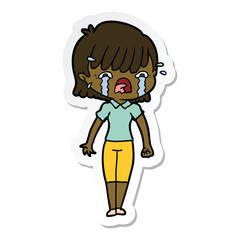 sticker of a cartoon girl crying