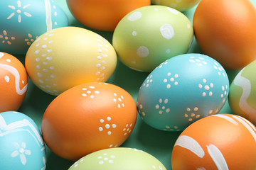 Many beautiful painted Easter eggs as background, closeup