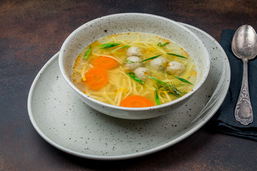 Chicken soup bouillon in a plate