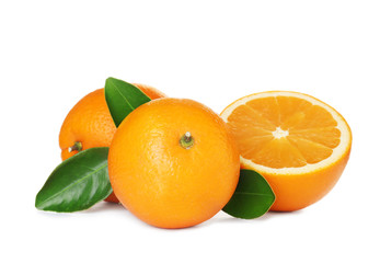 Fresh ripe oranges with leaves isolated on white