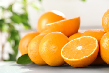 Fresh juicy oranges on table, space for text. Healthy fruits