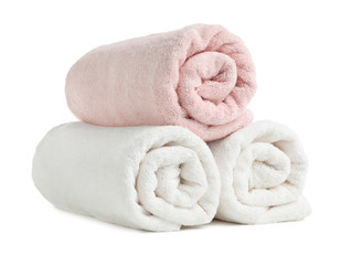 Fototapeta na wymiar Rolled soft terry towels on white background