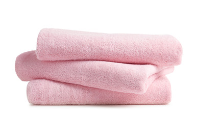 Stack of clean soft towels on white background