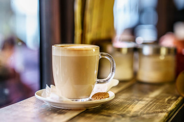 Coffee Latte on wooden table and latte art made with foam