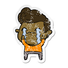 distressed sticker of a cartoon man crying