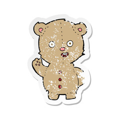 retro distressed sticker of a cartoon teddy bear