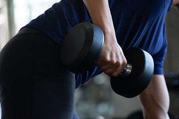 Thai Fitness man playing with Dumbell