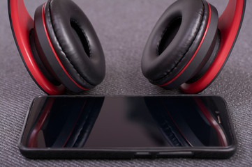smartphone with bluetooth headphones to listen to music.
