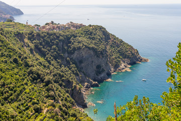 Naklejka premium Italy, Cinque Terre, Corniglia, Corniglia, HIGH ANGLE VIEW OF SEA AND TREES AGAINST SKY