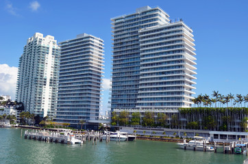 Luxury condo rental and condominium towers overlooking a small marina on the Florida Intra-Coastal waterway on Miami Beach,Florida