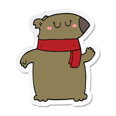 sticker of a cartoon bear with scarf