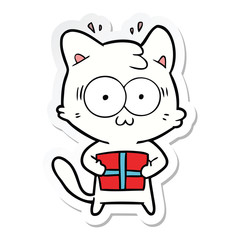 sticker of a cartoon surprised cat with christmas present