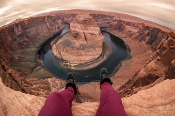 Hanging Legs, Shoes and Feet Over the Ledge at Horseshoe Bend